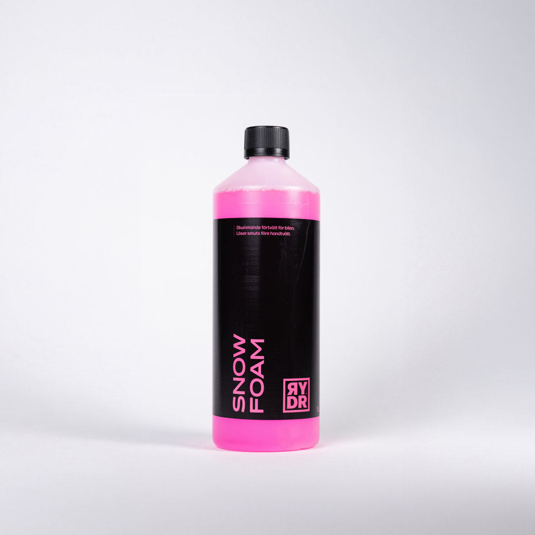 Vit flaska med RYDR rosa Snow Foam, 1L.