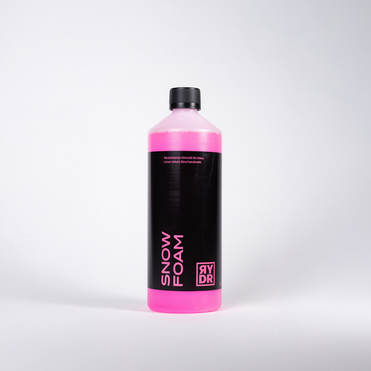 Vit flaska med RYDR rosa Snow Foam, 1L.